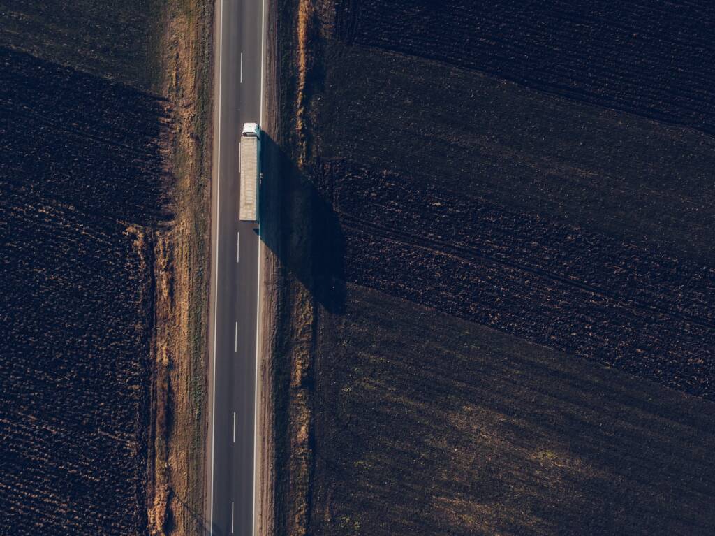 Aerial view of freight transportation truck on the road